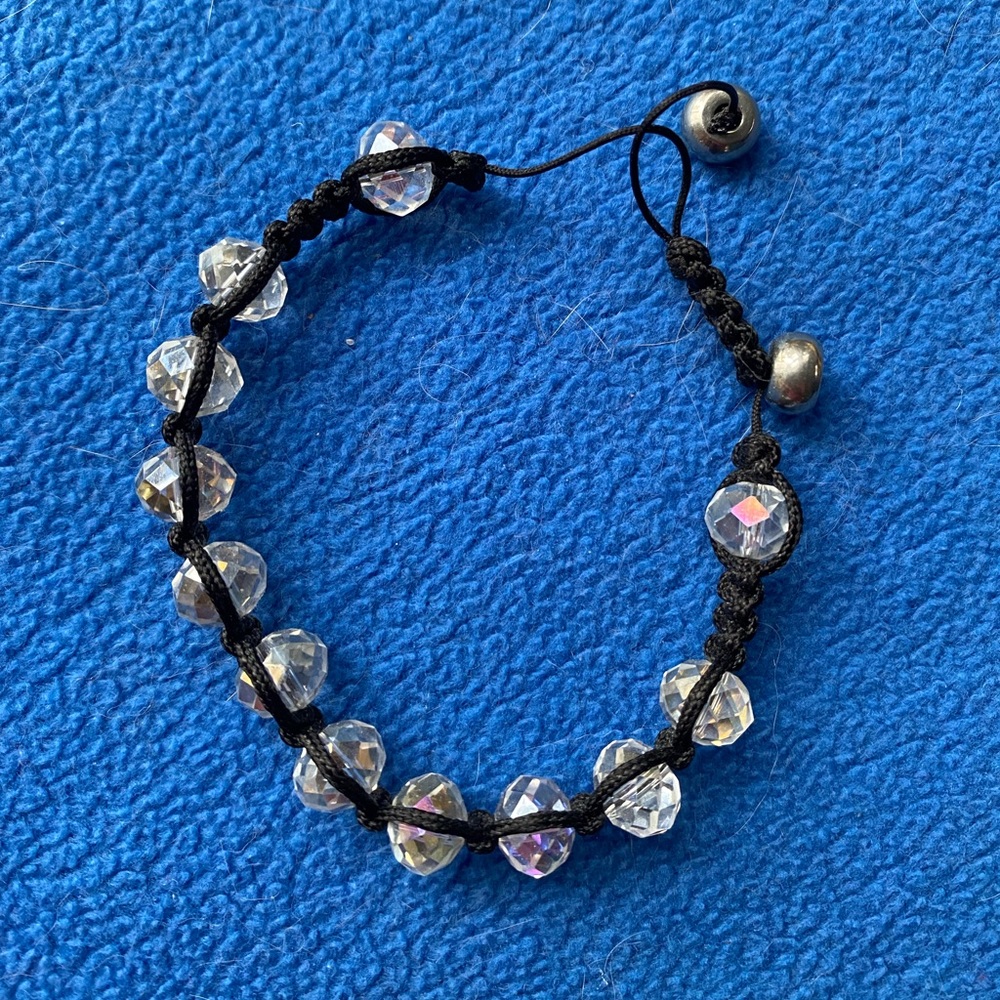 Czech crystal and cord slide bracelet with sterling beads.